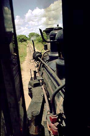 It gets hot in Africa. On the road, cab windows wide open to let in every bit of air possible